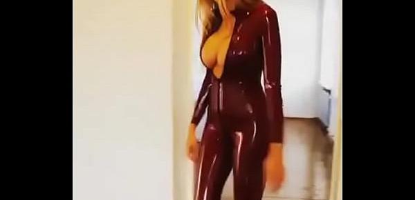  Sexy babe walks in latex catsuit